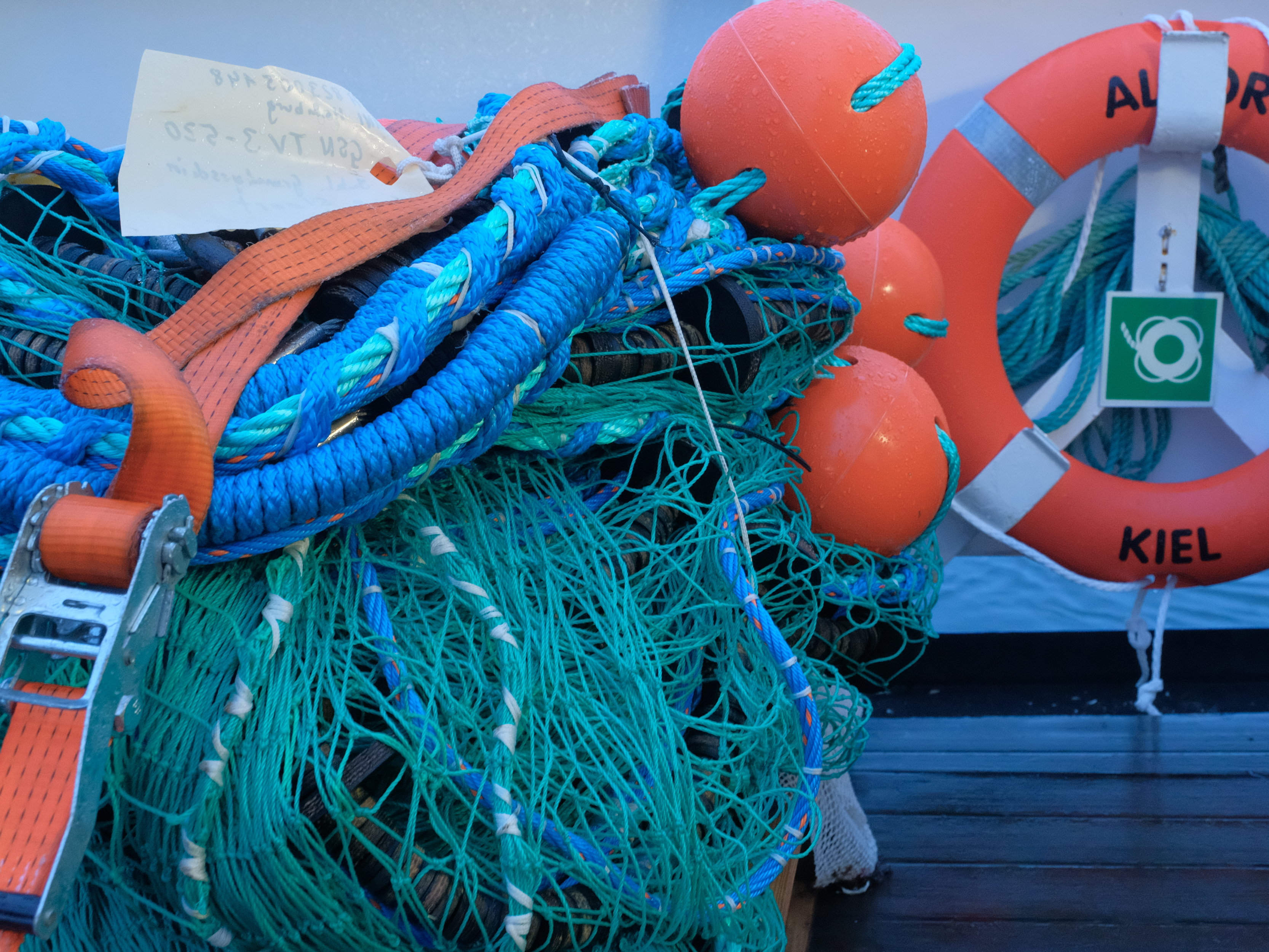 Fish nets, a lifebuoy bearing the inscription ‘ALKOR KIEL’ and other equipment on board the ALKOR